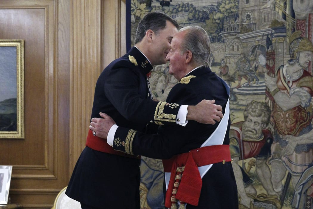 Felipe embraces his father Juan Carlos at  Zarzuela Palace.
