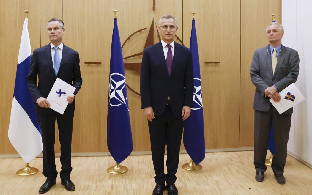 L to R: Finland's Ambassador to Nato Klaus Korhonen, Nato Secretary-General Jens Stoltenberg and Sweden's Ambassador to Nato Axel Wernhoff during a ceremony to mark Sweden's and Finland's application for membership in Brussels, on 18 May 2022.