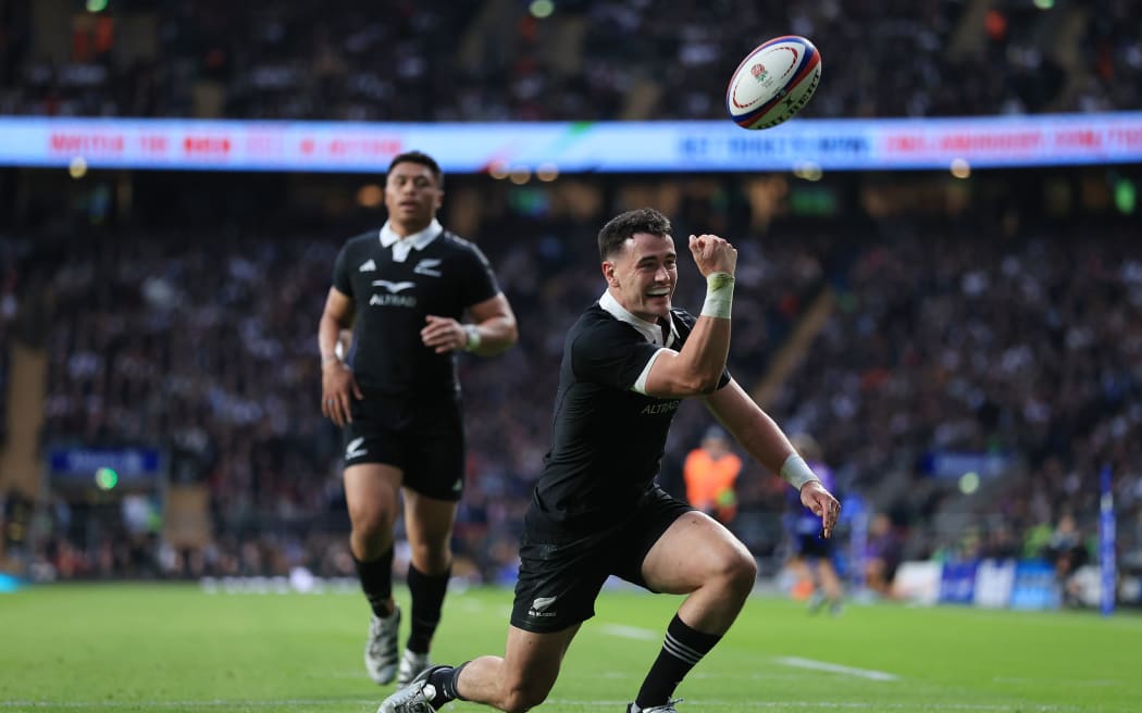 Will Jordan of New Zealand celebrates after scoring against England at Twickenham 2024.