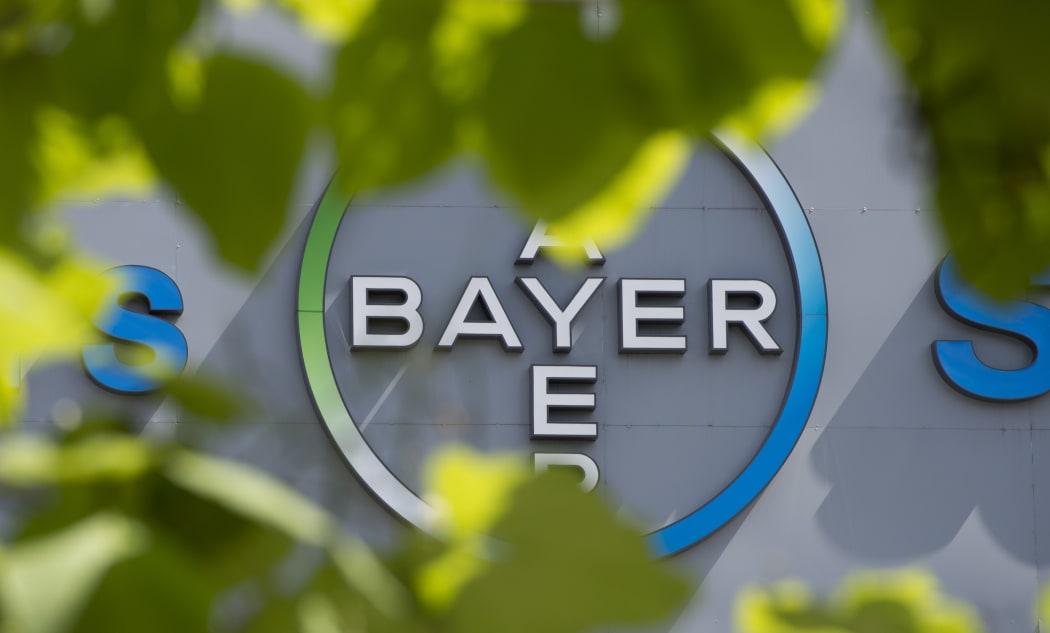 A logo of German pharmaceutical giant Bayer appears on an overpass at its Berlin headquarters July 24, 2013.