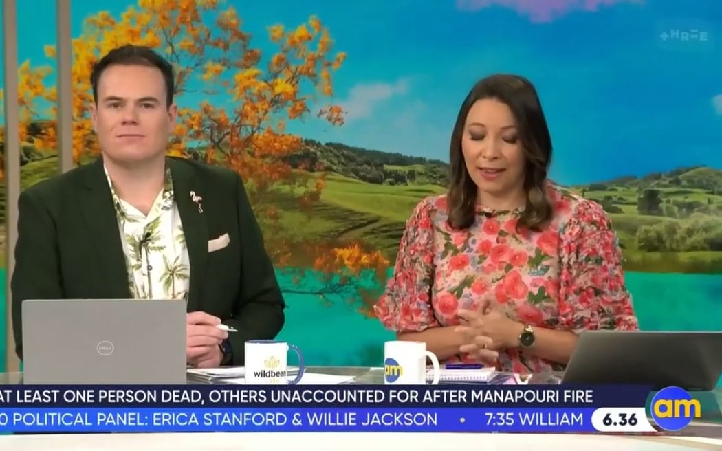 AM Show hosts Lloyd Burr and Melissa Chan-Green wearing bright colours during their final show.