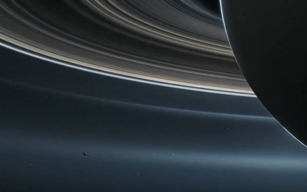 A NASA mock-up of the Cassini space probe flying close to Saturn.