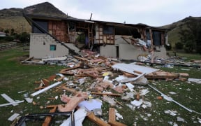 A house smashed in half by a boulder on the Port Hills in February 2011.