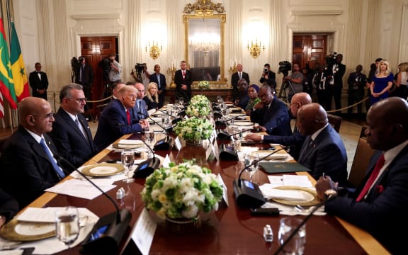 Liberian President Joseph Boakai, second from right, attends a lunch with other African leaders hosted by US President Donald Trump in the State Dining Room at the White House in Washington, DC, on July 9.
Mandatory Credit:	Kevin Lamarque/Reuters via CNN Newsource