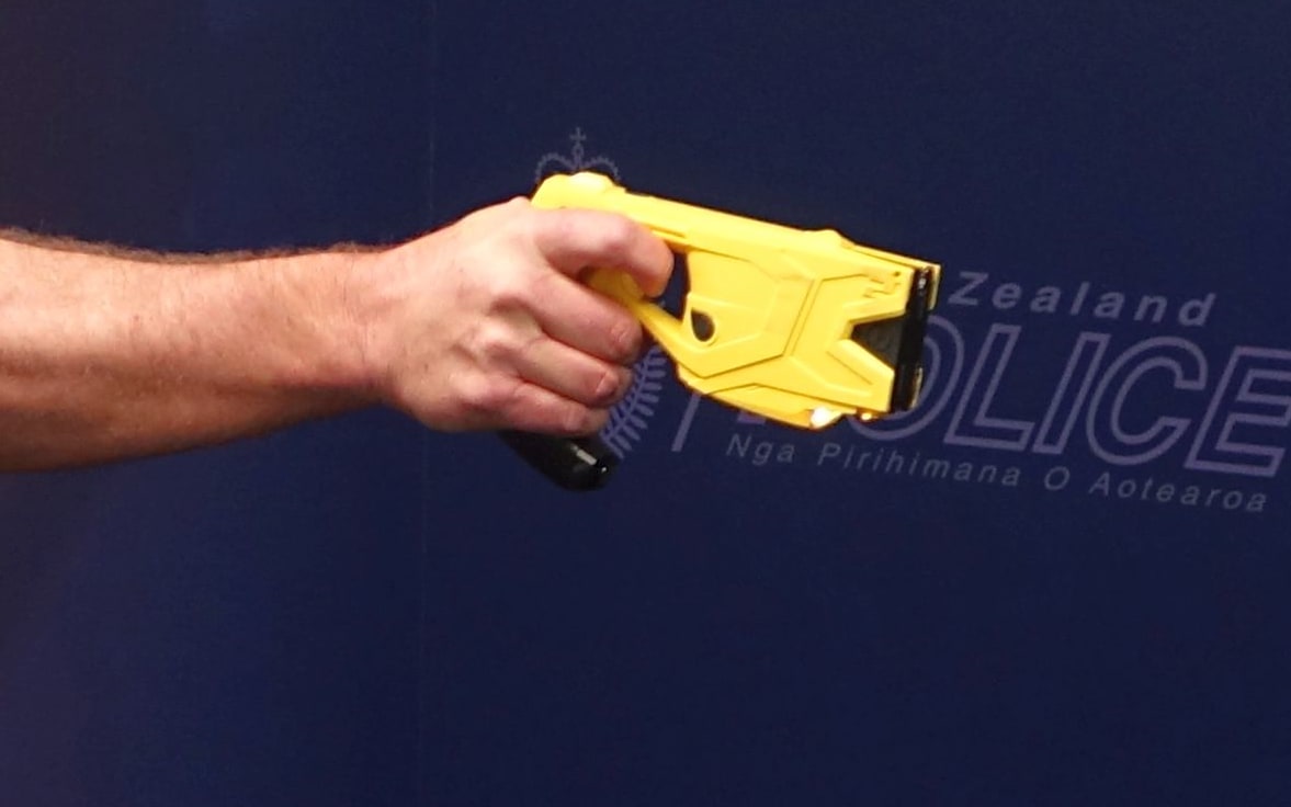 Sergeant Darrin Putt demonstrates the use of a taser.