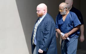 Officers escort James Bradley Jr, 60, at the federal courthouse in San Antonio, Texas.