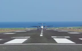 A plane lands on the upgraded runway at Hoskins airport in Papua New Guinea's West New Britain province.
