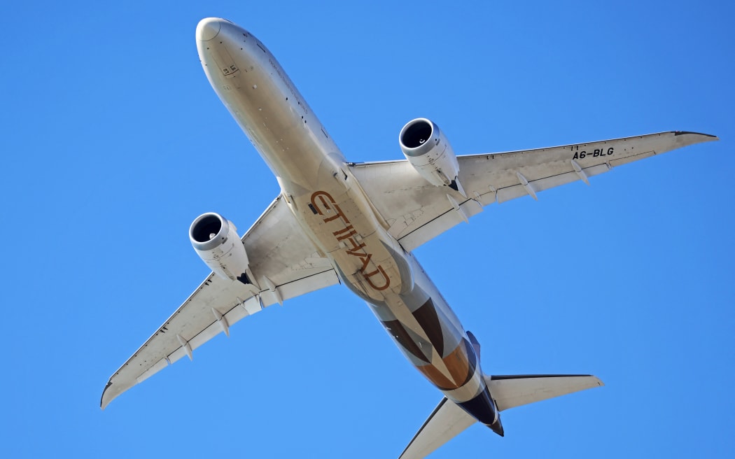 An Etihad Boeing 787-9 Dreamliner is in flight in Barcelona, Spain, on April 1, 2025. (Photo by Joan Valls/Urbanandsport/NurPhoto) (Photo by Urbanandsport / NurPhoto / NurPhoto via AFP)