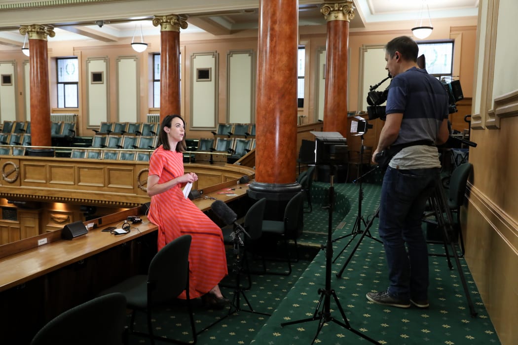 Newshub's political editor Tova O'Brien prepares for a live cross from the chamber's Press Gallery