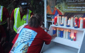Candles are lit to honour the fallen firemen