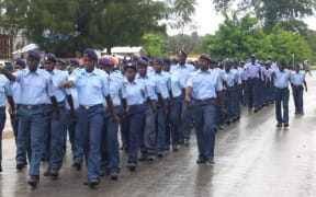 Papua New Guinea police officers marching in a parade