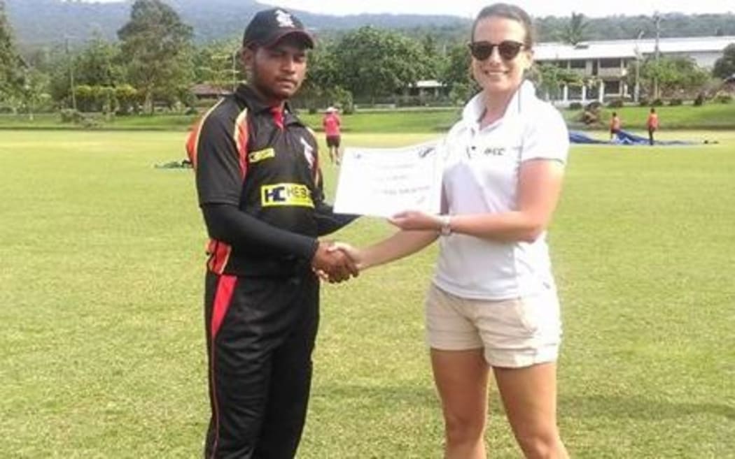PNG'S Vai Karaho is presented with his player of the match award
