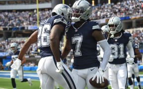 Dallas Cowboys players celebrate a touchdown.