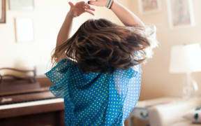 girl dancing in blue dress