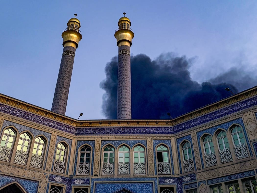 Smoke rises after an explosion occurred in downtown Tehran amid the third day of Israel's military strikes against Iran, Sunday, June 15, 2025. (Photo by Khoshiran / Middle East Images via AFP)