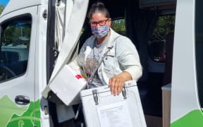 Registered nurse Melissa Nikora gets ready for the Covid-19 vaccination clinic at the Pongaroa Hotel on Friday 19 November, 2021.