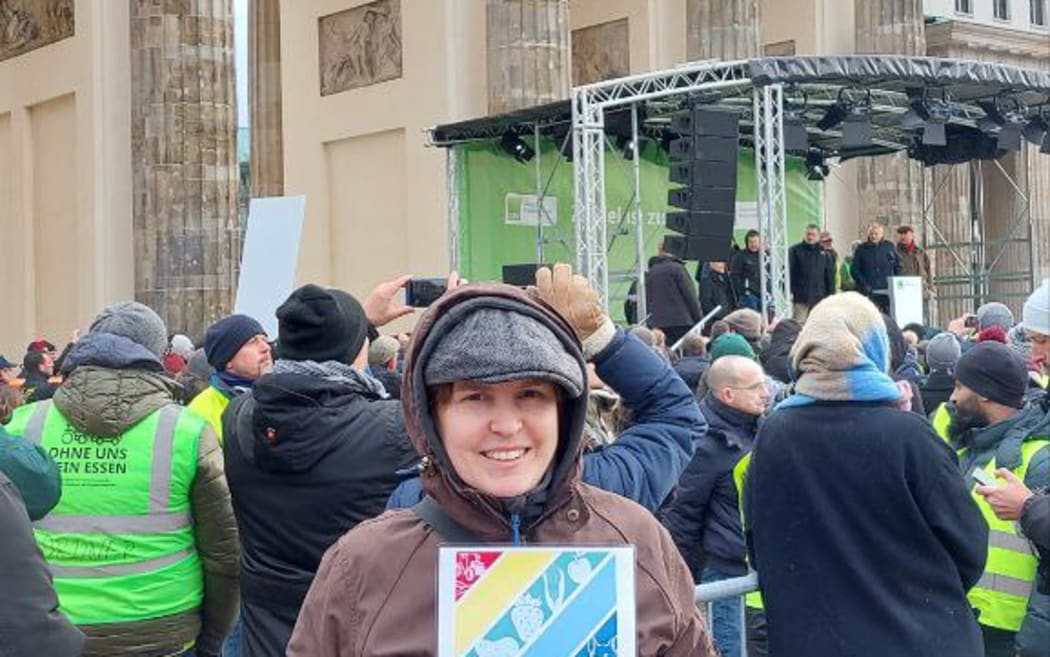 Jana Gäbert with other farmers protesting at Berlin's Brandenburg Gate