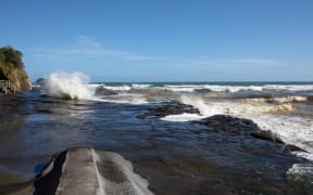 Muriwai Beach the day after a Burmese couple drowned while fishing off the rocks.