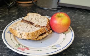 A Marmite sandwich and an apple.