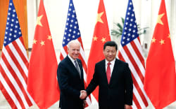 Chinese President Xi Jinping (right) shakes hands with US Vice President Joe Biden inside the Great Hall of the People in Beijing in December, 2013.