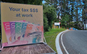 Mystery surrounds tongue in cheek digital billboard placed by an intersection where Waka Kotahi has recently finished work. Junction Road and State Highway 3.