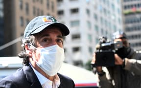 Michael Cohen arriving at his New York City apartment in May for home confinement.