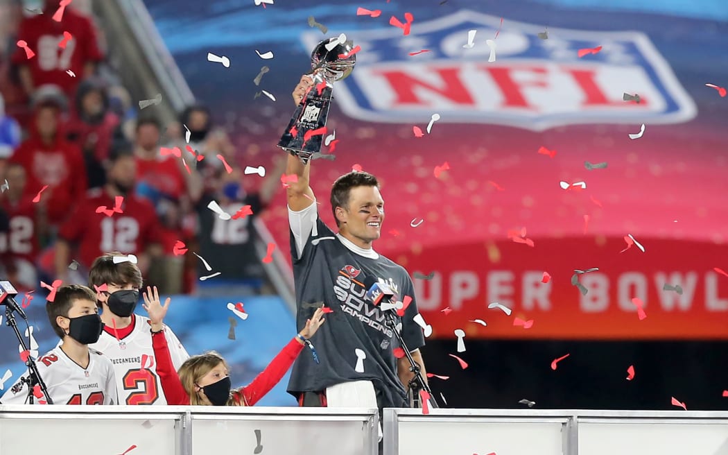 2021 Super Bowl MVP Tom Brady of the Buccaneers hoists the Lombardi Trophy.