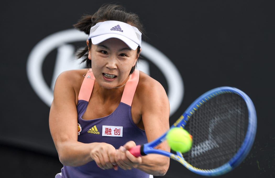 China's Shuai Peng hits a return against Japan's Nao Hibino during their women's singles match on day two of the Australian Open tennis tournament in Melbourne on January 21, 2020.