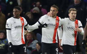 Luton Town players celebrate a goal.