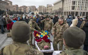 Relatives, friends and comrades attend the funeral ceremony for Oleg Yurchenko, Ukrainian officer killed in a battle against Russian troops near Bachmut in Donetsk, at Independence Square in Kyiv.