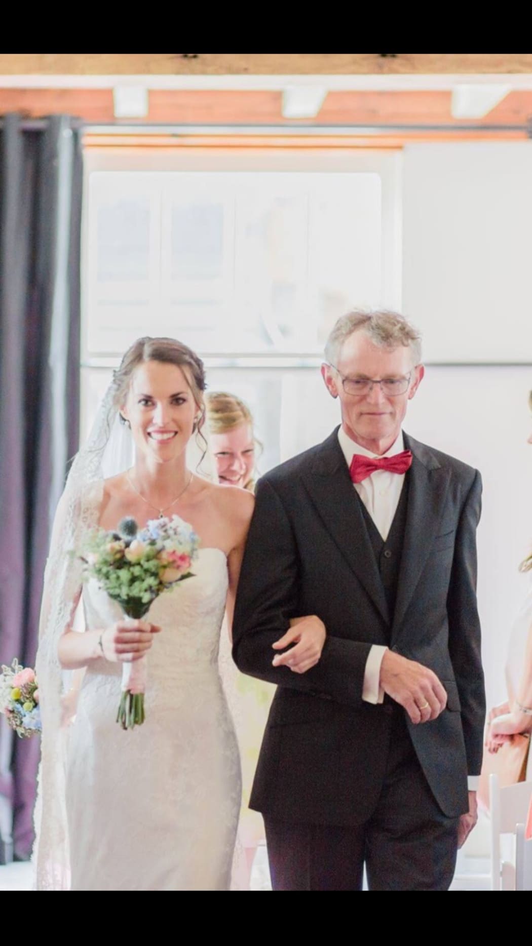 Melissa Hogenboom and her father Piet walking down the aisle on her wedding day