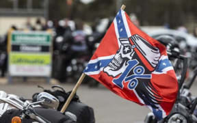 Rebels motorcycle gang flag and bikes, Australia.