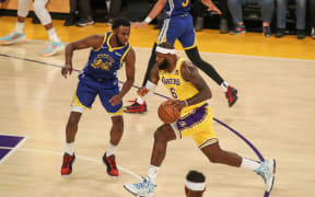 Los Angeles Lakers forward LeBron James drives to the hoop against the Golden State Warriors.